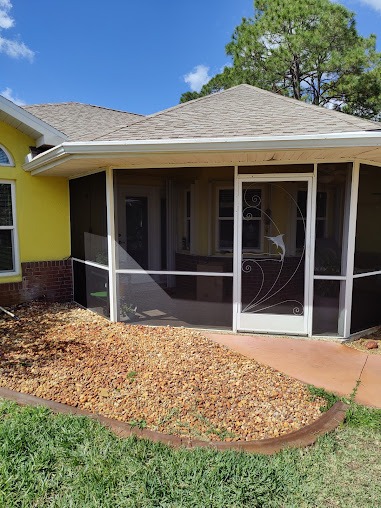 Screened porch with decorative screen door Sarasota